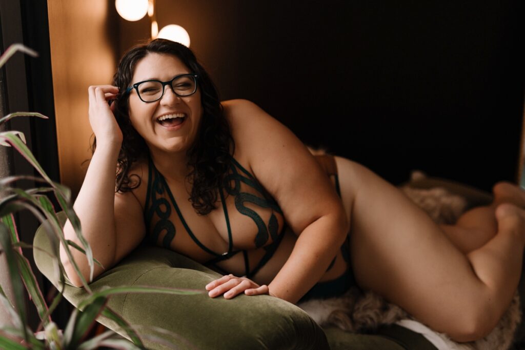 Orlando boudoir photographer guiding client through empowering photo session